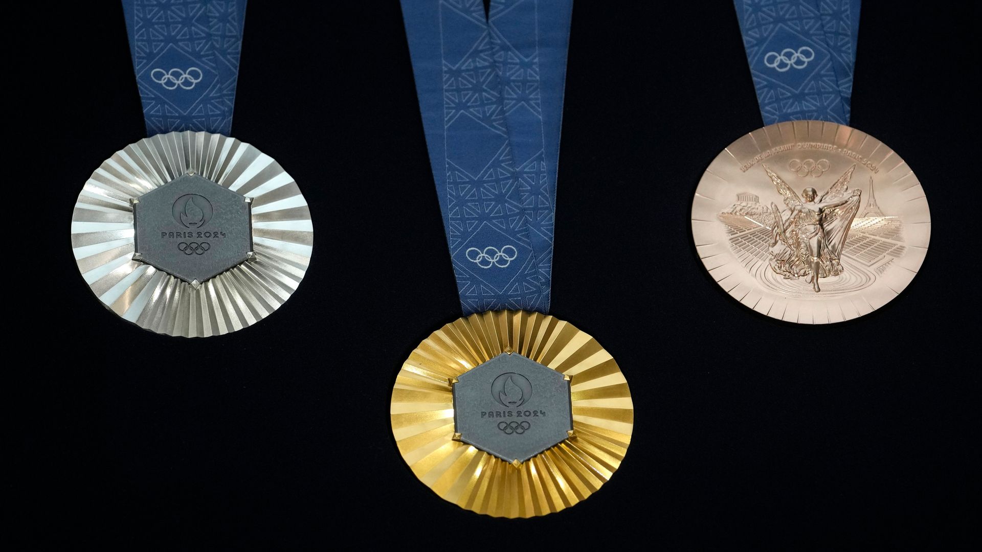 Olympic medals revealed - made with iron from the Eiffel Tower