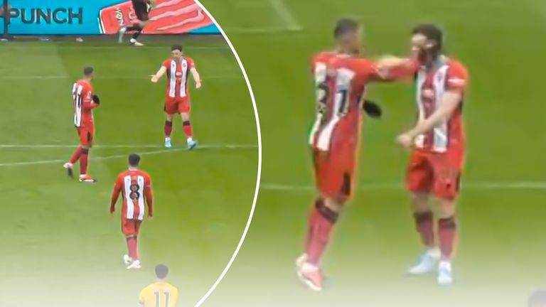 Sheffield United team-mates Jack Robinson and Vinicius Souza clash during the 1-0 defeat to Wolves at Molineux
