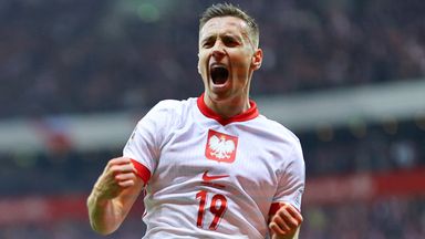 Przemyslaw Frankowski celebrates scoring for Poland