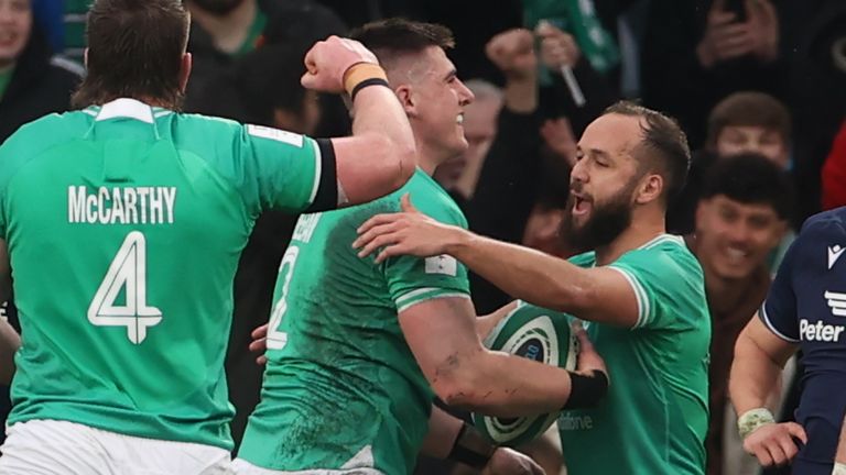 Sheehan celebrates scoring Ireland's opening try following a Scotland overthrow 