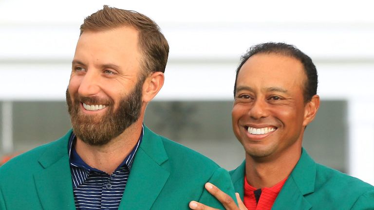 Dustin Johnson was presented with the Green Jacket by Tiger Woods in 2020 