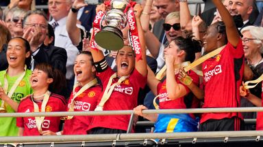 Manchester United captain Katie Zelem lifts the FA Cup