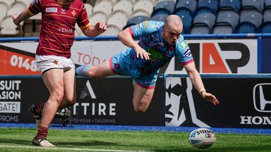Liam Marshall of Wigan dives in an attempt to ground the ball