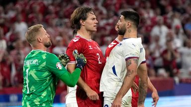 Serbia's Aleksandar Mitrovic, right, argues with Denmark's Joachim Andersen