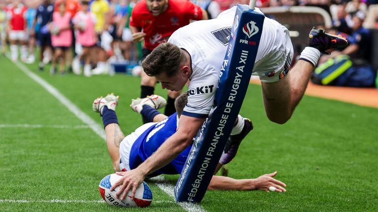 Jack Welsby dives over for his first try against France