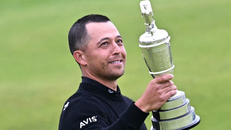 Xander Schauffele poses with the Claret Jug after winning The 152nd Open at Royal Troon