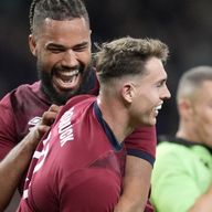 England's Tom Roebuck (second left) is congratulated by Chandler Cunningham-South (left) after scoring his try