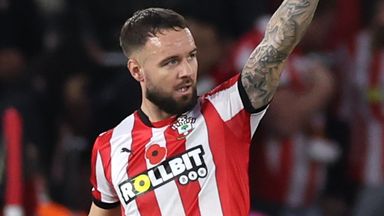 Adam Armstrong salutes the crowd after scoring a late goal for Southampton against Everton