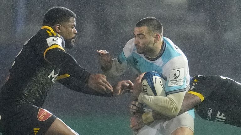 Bath's Will Muir (centre) is tackled by Stade Rochelais' Jack Nowell during the Investec Champions Cup match at The Recreation Ground, Bath. 