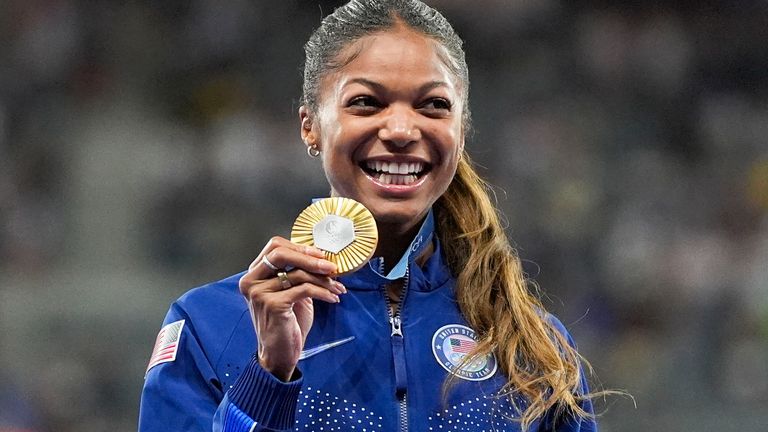 Thomas with her gold medal for winning the 200m Olympics final in Paris last summer