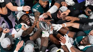 Philadelphia Eagles players celebrate with the Vince Lombardi Trophy after their Super Bowl 59 hammering of the Kansas City Chiefs