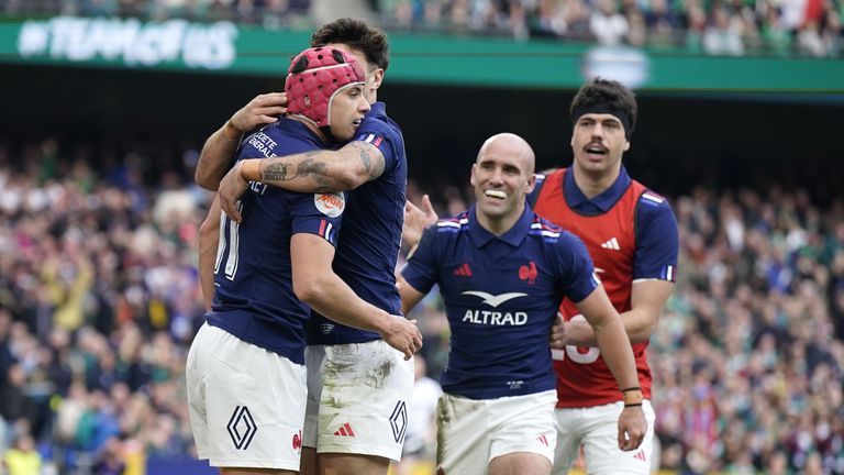 Bielle-Biarrey celebrates with his France team-mates after scoring a try