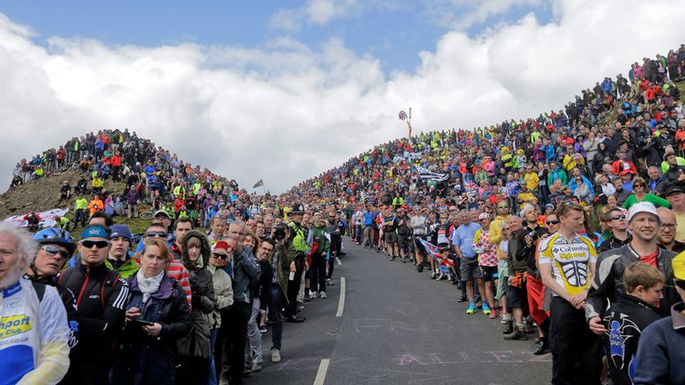 Spectators wait for the cyclists to climb Buttertubs pass during the first stage of the Tour de France in 2014, which began in Leeds and finished in Harrogate