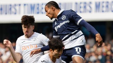 Femi Azeez lepa to win a header during Millwall's win against Swansea