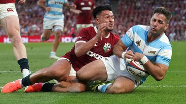 Argentina's Santiago Cordero holds off Marcus Smith to score his side's third try against the British and Irish Lions