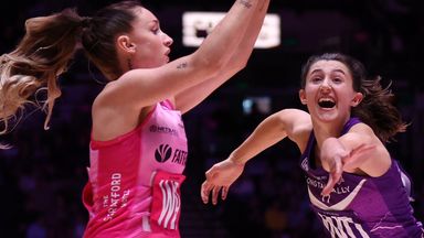 Alicia Scholes of London Pulse catches the ball under pressure from Beth Cobden of Loughborough Lightning in the Netball Super League