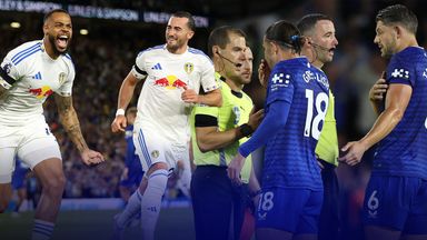 Lukas Nmecha celebrates scoring a penalty with team-mate Jack Harrison (left), while James Tarkowski and Jack Grealish complain to officials
