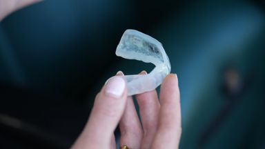 One of the new flashing mouthguards, designed to help alert officials to potential concussion