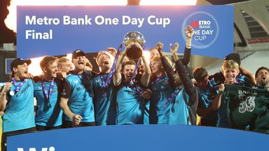 Worcestershire lift the trophy with Josh Baker's shirt displayed among the celebrations