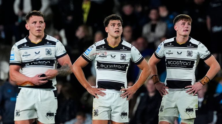 Hull FC players stand dejected after the full-time whistle