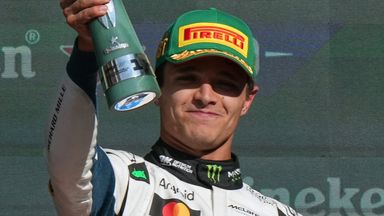 Norris celebrates with the trophy after winning the Mexico City Grand Prix