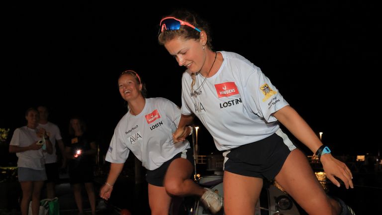 Jess Rowe (L) and Miriam Payne (R) arriving into Australia after becoming the first female crew to row non-stop and unaided across the Pacific