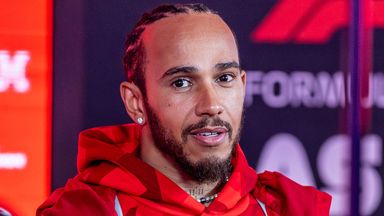 Lewis Hamilton answer questions from the reporters in the paddock