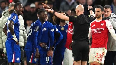 Referee Anthony Taylor signals for the VAR check