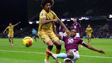 Chris Richards of Crystal Palace is tackled by Florentino Luis of Burnley
