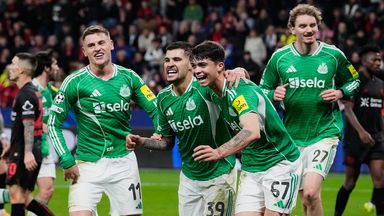 Newcastle's Lewis Miley, right, celebrates his side's second goal during the Champions League opening phase soccer match between Bayer Leverkusen and Newcastle United in Leverkusen, Germany, Wednesday, Dec. 10, 2025. (AP Photo/Martin Meissner)