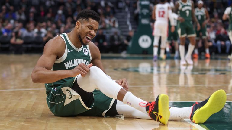 Antetokounmpo was helped off the court by his team-mates after falling to the floor