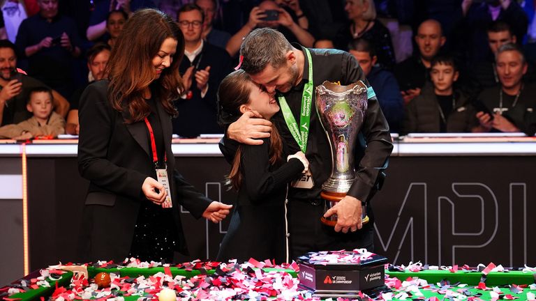 Mark Selby celebrates with his wife Vikki Layton and daughter Sofia, who was just two years old when he last won this title