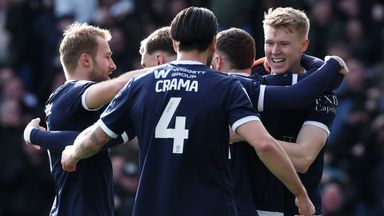 Millwall players celebrate after taking the lead against Charlton through a Kayne Ramsay own goal