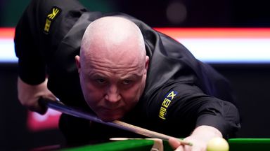 John Higgins in action against Barry Hawkins (out of picture) on day three of the 2026 Johnstone's Paint Masters