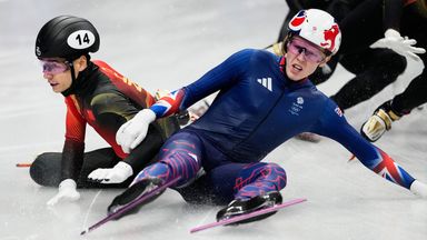 Niall Treacy of Britain crashes into Shin Dong Min of South Korea in the finals of the men's 1500 short track speed skating