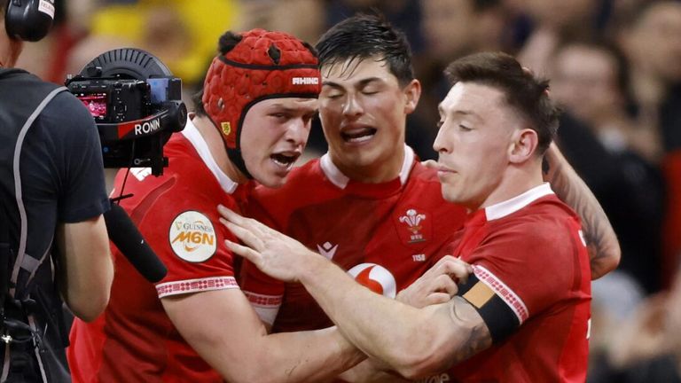 Josh Adams (right) scored Wales' second as they went in 17-5 ahead at half-time