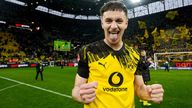 Image of Luca Reggiani of Borussia Dortmund reacts following the win over Augsburg in which he scored