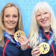 Kelly Gallagher (right) with guide Charlotte Evans (left) after winning gold in the Women's Super-G - Visually Impaired at the Sochi Games