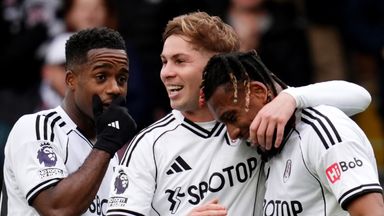 Alex Iwobi celebrates with his Fulham team-mates after doubling their lead against Spurs