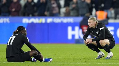 Jeremy Doku and Erling Haaland react at the final whistle