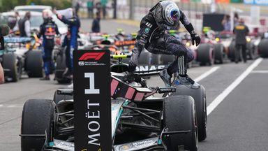 Mercedes driver Kimi Antonelli of Italy leaps from his car after winning the Japanese Formula One Grand Prix at Suzuka in central Japan, Sunday, March 29, 2026. (AP Photo/Eugene Hoshiko)