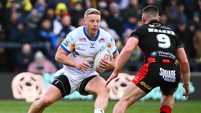 Picture by Olly Hassell/SWpix.com - 29/03/2026 - Rugby League - Betfred Super League Round 6 - Leeds Rhinos v Warrington Wolves - AMT Headingley, Leeds, England - Lachie Miller of Leeds evades Danny Walker of Warrington