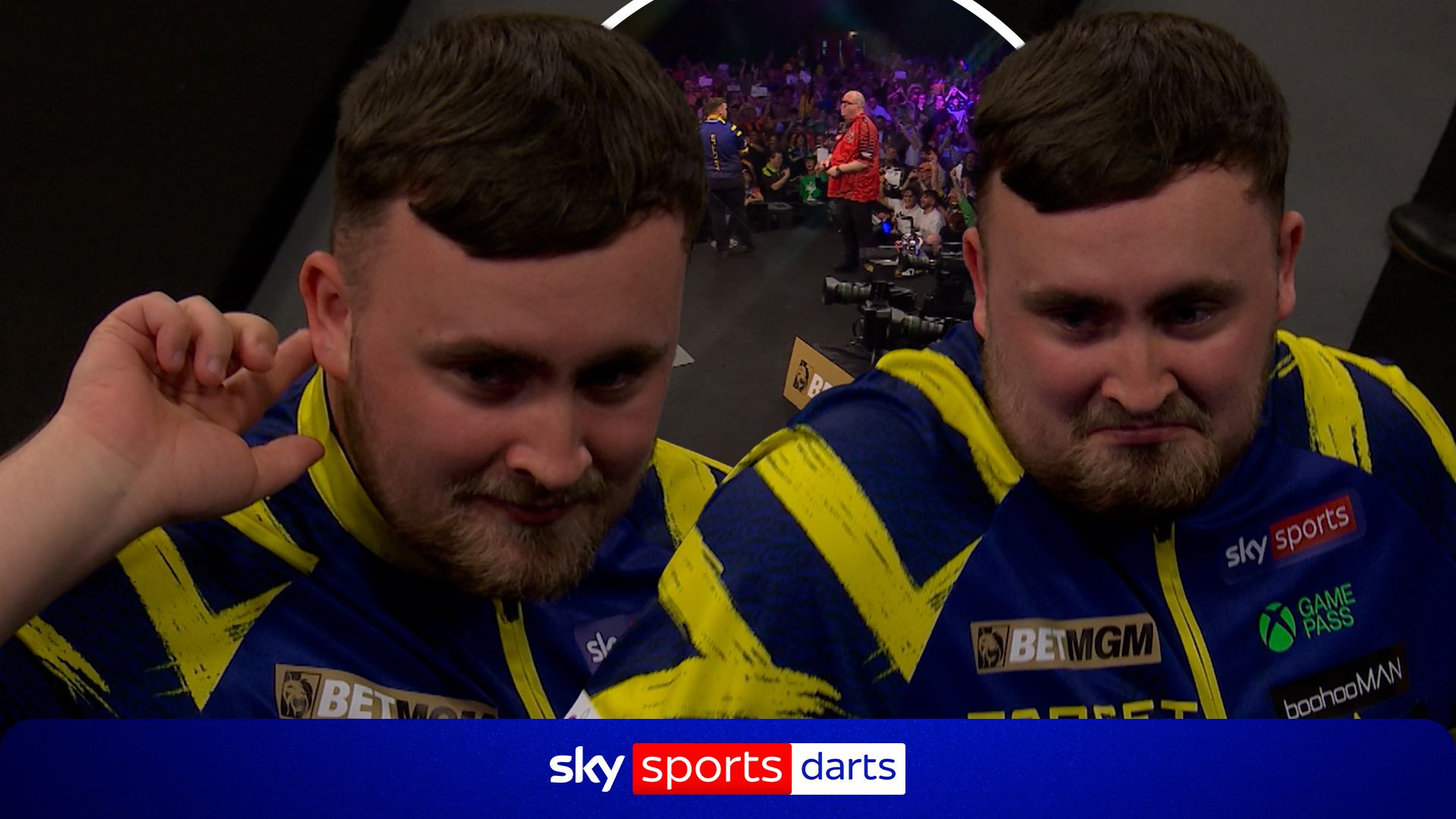 Littler goads the crowd after hearing boos during his walk-on in Brighton