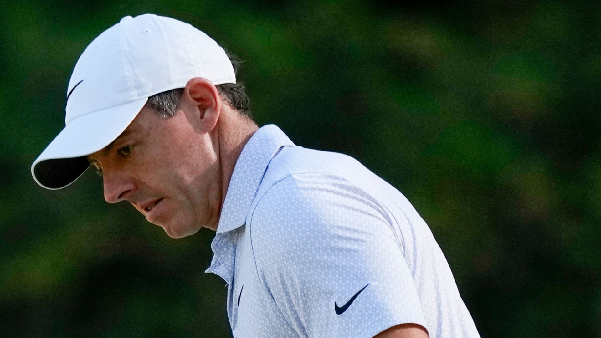 McIlroy races into historic Masters lead as DeChambeau misses cut