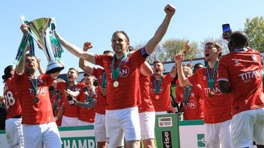 York City's players celebrate with the Enterprise National League trophy after winning promotion back to the Football League