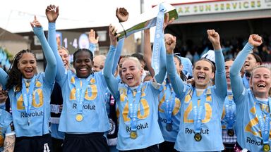 Alex Greenwood lifts the WSL trophy and celebrates with her Manchester City team-mates