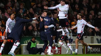 Bolton players celebrate Xavier Simons' late goal that sealed a 2-0 aggregate win over Bradford