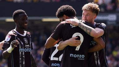 Coventry players congratulate goalscorer Ellis Simms at Vicarage Road
