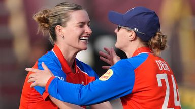 England's Lauren Bell and Charlie Dean celebrate dismissing India's Smriti Mandhana 