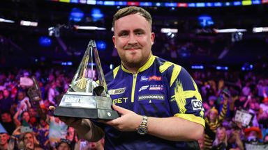 Littler displays the Premier League Darts trophy